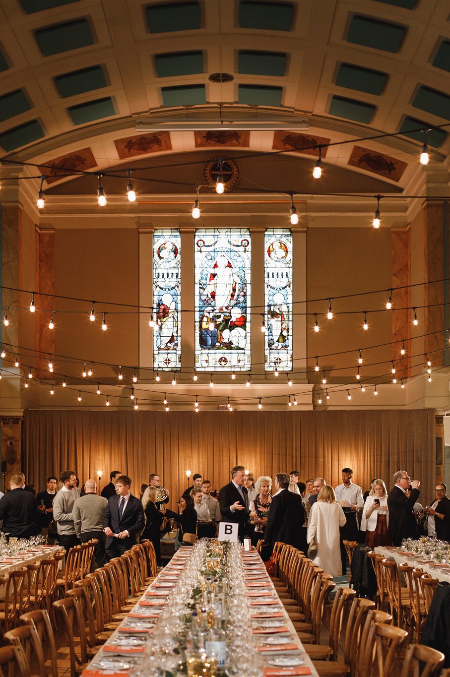  long-table dinner event hosted at St Mary’s London, demonstrating how church spaces can be transformed for professional venue hire while preserving their mission and beauty