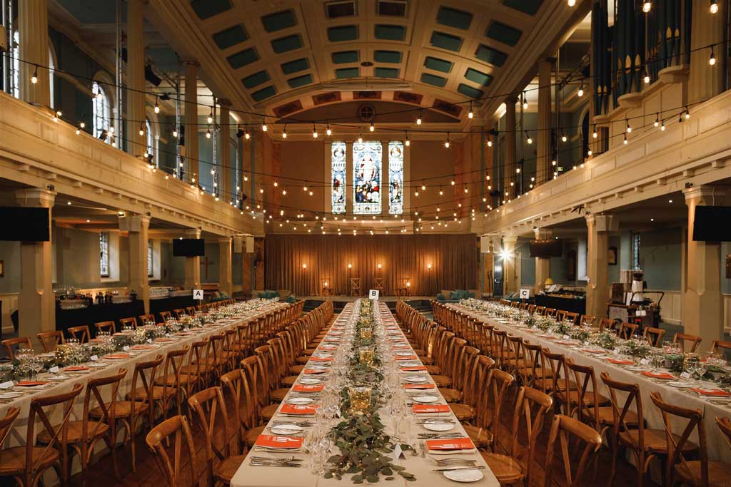 The Great Hall at St Mary’s set for a large formal event, showcasing the venue transformation with upgraded lighting, décor, and layout to support income generation through high-value bookings.