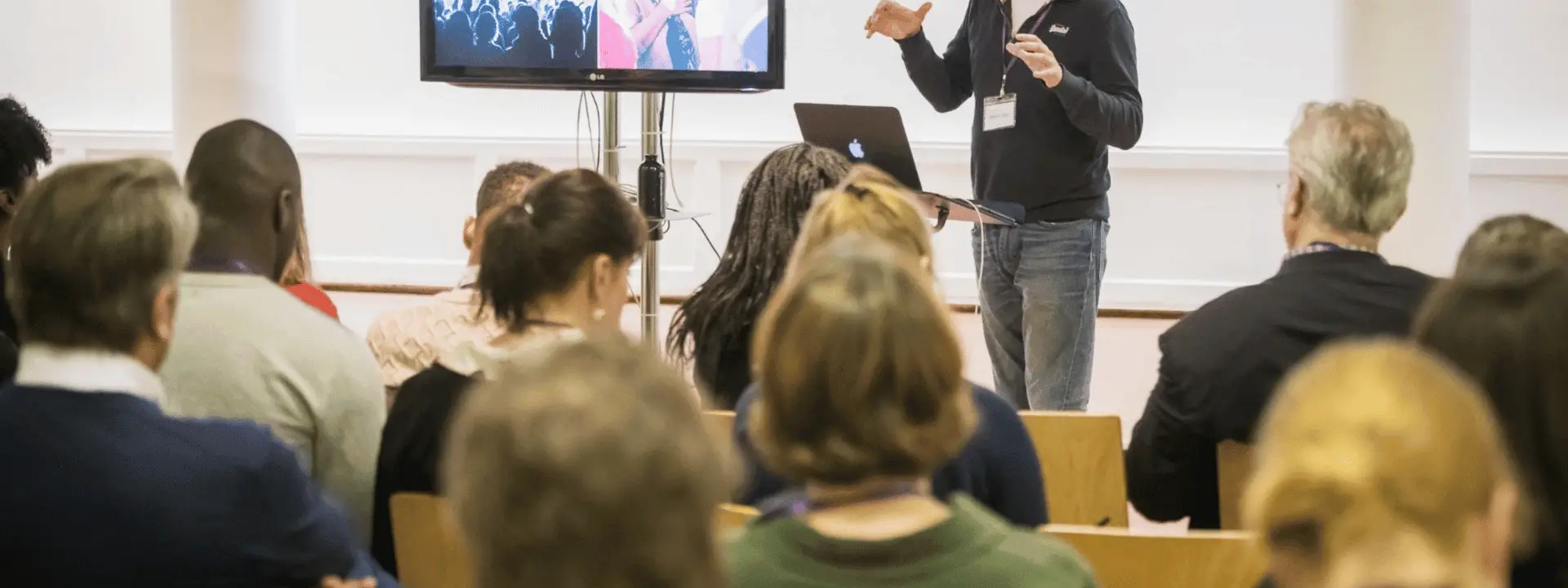 Speaker presenting to a seated audience at a church venue hire event